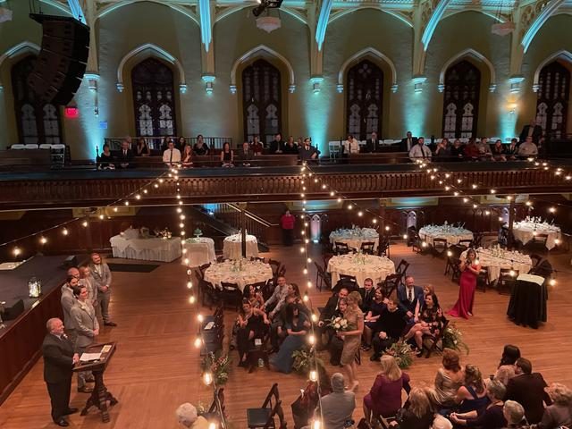 Warm string bulb lighting strung across a venue